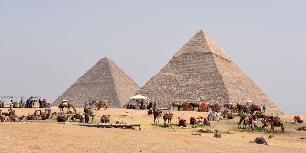 Egyptian camel owners wait for tourists outside the pyramids, on the Giza Plateau, on the southern outskirts of the capital Cairo on March 29, 2017. / AFP PHOTO / MOHAMED EL-SHAHED (Photo credit should read MOHAMED EL-SHAHED/AFP/Getty Images)