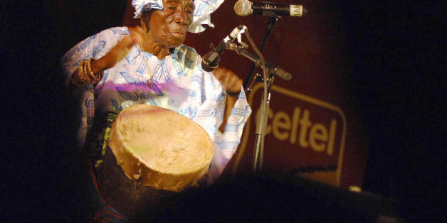Zanzibar, TANZANIA, UNITED REPUBLIC OF: Zanzibari legend singer Bi Kidude bint Baraka, in her nineties, performs at the third Sauti za Busara Music Festival, 11 February 2006 in Zanzibar. Starting back in the 1920s, Bi Kidudue is the Island's leading exponent of the ancient ritual dance, performed exclusively for teenage girls, which use traditional rythym to teach women to please their husbands, while lecturing against the dangers of sexual abuse and oppression. Late 2005, Bi Kidude was awarde