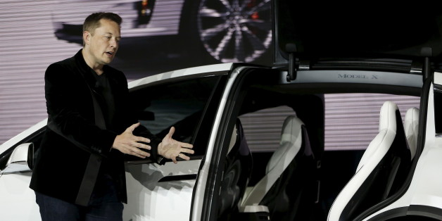Tesla Motors CEO Elon Musk introduces the falcon wing door on the Model X electric sports-utility vehicles during a presentation in Fremont, California September 29, 2015. Tesla Motors delivered the first of its long-awaited Model X electric sports-utility vehicles on Tuesday, a product investors are counting on to make the pioneering company profitable after years of losses. REUTERS/Stephen Lam