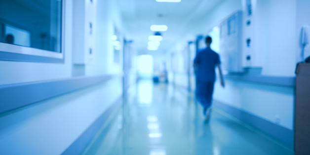 Hospital corridor and doctor as a blurred defocused background