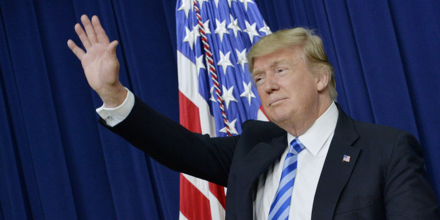 U.S. President Donald Trump waves during a town hall meeting with executives on the America business climate in the South Court Auditorium of the White House in Washington, D.C., U.S., on Tuesday, April 4, 2017. Trump has vowed to flatten regulatory hurdles for American business, and Congress's proposed EPA rules for science would make commerce easier. Photographer: Olivier Douliery/Bloomberg via Getty Images