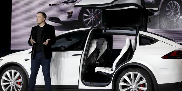 Tesla Motors CEO Elon Musk introduces the falcon wing door on the Model X electric sports-utility vehicles during a presentation in Fremont, California, U.S. September 29, 2015. REUTERS/Stephen Lam/File Photo