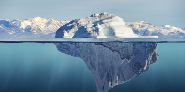 iceberg with above and underwater view taken in greenland