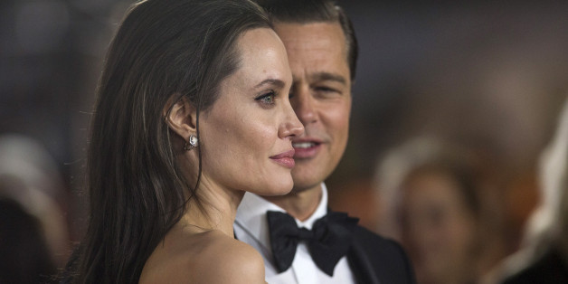 Director and cast member Angelina Jolie and her husband and co-star Brad Pitt pose at the premiere of "By the Sea" during the opening night of AFI FEST 2015 in Hollywood, California November 5, 2015. REUTERS/Mario Anzuoni/File Photo