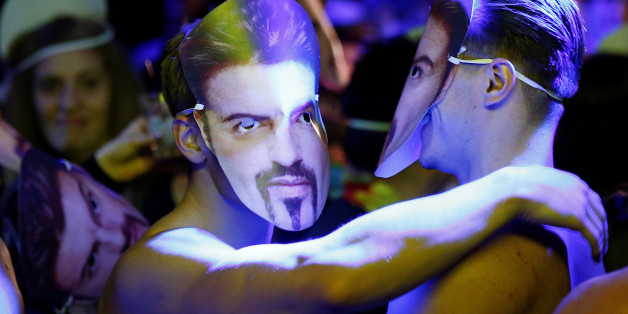 Dancers wear George Michael masks at a tribute night event in his honour, in London, Britain, January 6, 2017. REUTERS/Peter Nicholls