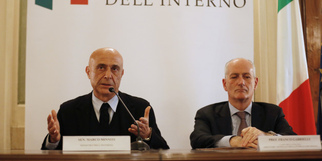 Italian Interior Minister Marco Minniti (L) and cheif of police Franco Gabrielli attend a news conference in Rome, Italy, to announce that the suspect in the Berlin truck attack was killed in a shoot-out in a suburb of the norhtern Italian city of Milan, December 23, 2016. REUTERS/Alessandro Bianchi