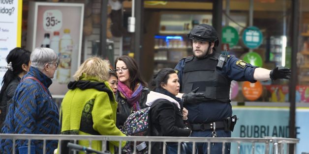 Police direct people after a truck crashed into the Ahlens department store at Drottninggatan in central Stockholm, April 7, 2017.
A truck slammed into a crowd of people outside a busy department store in central Stockholm, causing 'deaths' in what the prime minister described as a 'terror attack.' / AFP PHOTO / TT News Agency / Claudio BRESCIANI / Sweden OUT (Photo credit should read CLAUDIO BRESCIANI/AFP/Getty Images)
