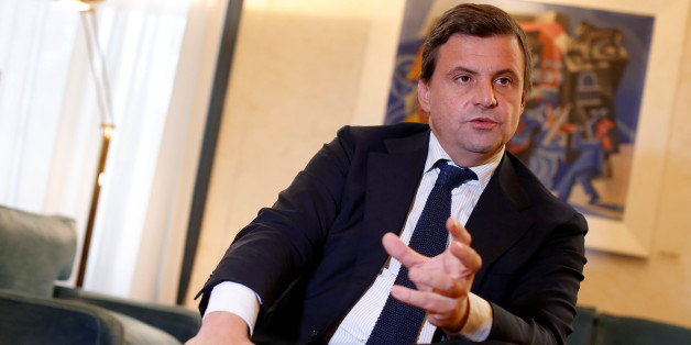 Italian Industry Minister Carlo Calenda gestures as he talks during an interview with Reuters in his office in Rome, Italy November 25, 2016. REUTERS/Tony Gentile