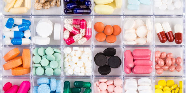 Various medicine pills and capsules in plastic container