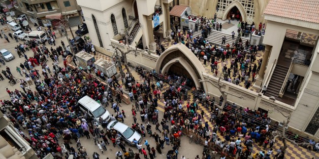 TANTA, EGYPT - APRIL 9: People gather in front of the Saint George church after a bombing struck inside the church in the Nile Delta city of Tanta, Egypt on April 9, 2017. At least 21 people were killed. (Photo by Ibrahim Ramadan/Anadolu Agency/Getty Images)