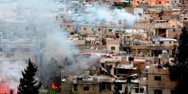 SIDON, LEBANON - APRIL 9: Smoke rises after clashes between members of Palestinian Fatah Movement and Bilal Badr at the Ain-el-Hilwe refugee camp in Sidon, Lebanon on April 9, 2017. (Photo by Ratib Al Safadi/Anadolu Agency/Getty Images)