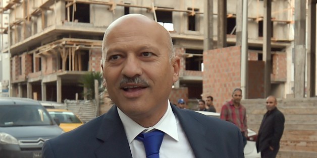 Ridha Belhaj, Executive Board member and Chief of Staff of the Tunisian president arrives for a meeting for the Executive Bureau of the Nidaa Tounes party on November 12, 2015 in Tunis, to try to solve the problems that the party has experienced in recent months. The secularist Nidaa Tounes, elected to power last year in a vote hailed as a democratic victory after Tunisia's Arab Spring revolt, has been riven by months of infighting and 31 lawmakers from the party resigned from their parliamentary bloc on November 9, deepening a row over party succession. AFP PHOTO / FETHI BELAID (Photo credit should read FETHI BELAID/AFP/Getty Images)