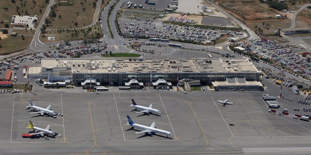 An aerial file picture of the state Nikos Kazantzakis airport in the city of Heracleion on the island of Crete taken on April 20, 2010. Greece intends to review a 1.2 billion euro ($1.36 billion) deal with German airport operator Fraport to run 14 Greek airports, with a government minister saying the contract would be put on ice. The airports, put up for lease in 2014 to boost Athens' depleted cash reserves, include Thessaloniki, the second largest city in the country, and those of tourist hotspots. The new radical left government, which swept to power at the end of January and is currently embroiled in negotiations over its bailout obligations, had promised voters it would halt the privatisations. AFP PHOTO/ COSTAS METAXAKIS (Photo credit should read Costas Metaxakis/AFP/Getty Images)