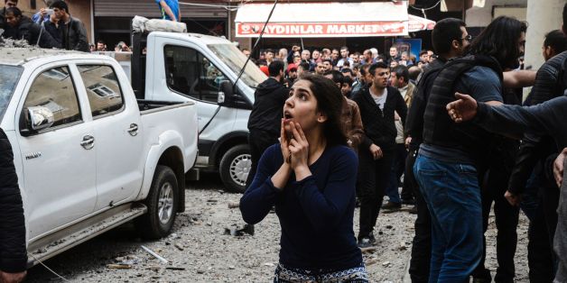 A woman reacts as she looks at the site of a strong blast near the riot police headquarters in the center of Diyarbakir, southeastern Turkey, on April 11, 2017.
The explosion which shook police headquarters in Diyarbakir on Tuesday morning was an accident which occurred during repair work. According to Turkey's Interior Minister, no external forces had been involved in the incident in the restive majority Kurdish city which happened during repair work on armoured vehicles at police headquarters. He said one person was seriously hurt while another was trapped under rubble.
/ AFP PHOTO / ILYAS AKENGIN (Photo credit should read ILYAS AKENGIN/AFP/Getty Images)