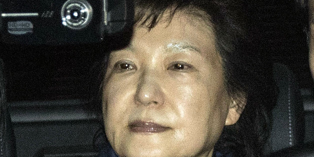 Park Geun-hye, former president of South Korea, center, leaves the Seoul Central Prosecutors' Office in Seoul, South Korea, on Friday, March 31, 2017. A South Korean court has ordered the arrest of Park after prosecutors sought to detain her on suspicion of bribery and abuse of powers. Photographer: Lee Yong-ho/Pool via Bloomberg