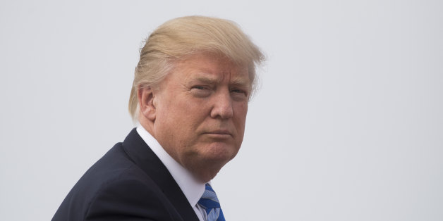 US President Donald Trump boards Air Force One at Andrews Air Force Base, Maryland, April 13, 2017. / AFP PHOTO / JIM WATSON (Photo credit should read JIM WATSON/AFP/Getty Images)