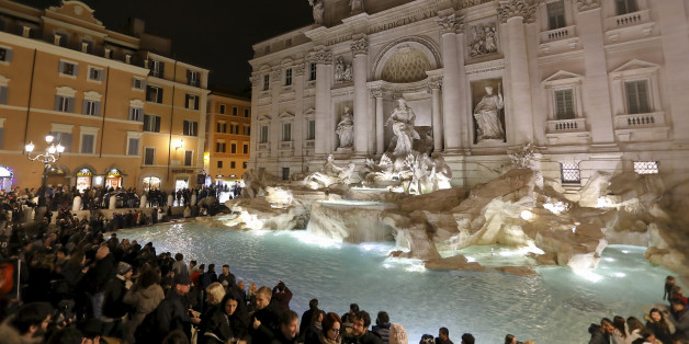 ROME, ITALY - JANUARY 02: Trevi Fountain (Fontana di Trevi) illumintated at night on January 02, 2017 in Rome, Italy. The Trevi Fountain is a fountain in the Trevi district in Rome. Designed by Italian architect Nicola Salvi and completed by Pietro Bracci. Standing 26 metres high and 49 metres wide it is the largest Baroque fountain in the city and one of the most famous fountains in the world. The fountain has appeared in several notable films, including Federico Fellini's La Dolce Vita. (Photo