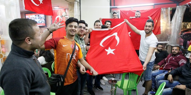 BEIRUT, LEBANON - APRIL 16: Yes' supporters celebrate their victory following the unofficial preliminary results of Turkeys constitutional referendum show 'Yes' votes ahead of 'No' votes, in Beirut, Lebanon on April 16, 2017. Turkish people voted on the proposed change to a presidential system to replace the parliamentary democracy, with 18 articles proposed to be amended in the constitution.
(Photo by Furkan Guldemir/Anadolu Agency/Getty Images)