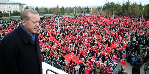 ANKARA, TURKEY - APRIL 17: (----EDITORIAL USE ONLY MANDATORY CREDIT - 'TURKISH PRESIDENCY / YASIN BULBUL / HANDOUT' - NO MARKETING NO ADVERTISING CAMPAIGNS - DISTRIBUTED AS A SERVICE TO CLIENTS----) Turkish President Recep Tayyip Erdogan greets the crowd, who were waiting to celebrate the results of the referendum, after he arrived in the Esenboga International Airport in Ankara, Turkey on April 17, 2017. (Photo by Turkish Presidency / Yasin Bulbul/Anadolu Agency/Getty Images)