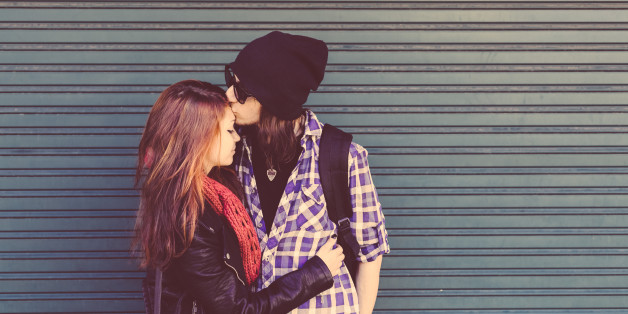 Young couple kissing outside