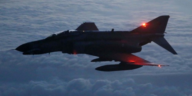 ADANA, TURKEY - JANUARY 14 : Turkish Air Force's F-4 fighter jet gets ready to hook up a boom to receive mid-air refueling from a refueler tanker over Adana, Turkey on January 14, 2014. Turkish Air Force's F-16s and F-4 fighter jets from 101st Air Refueling Wing based in 10. Tanker Base Command at Incirlik Air Base of Adana perform aerial refueling at 24,000 feet high altitude with a cruise speed of 950km/h. (Photo by Veli Gurgah/Anadolu Agency/Getty Images)