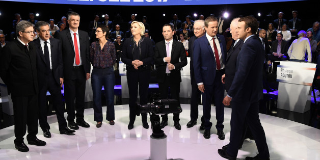 Candidates pose prior to a prime-time televised debate for the French 2017 presidential election in La Plaine Saint-Denis, near Paris, France, April 4, 2017. L to R: Jean-Luc Melenchon of the Parti de Gauche, Francois Fillon of the Republicans party, Jean Lassalle, Nathalie Arthaud of France's extreme-left Lutte Ouvriere party (LO), Marine Le Pen of French National Front (FN), Benoit Hamon of the French Socialist party, Jacques Cheminade, Nicolas Dupont-Aignan of Debout La France group, Francois Asselineau of UPR party, and Emmanuel Macron of the political movement En Marche ! (Onwards !). REUTERS/Lionel Bonaventure/Pool