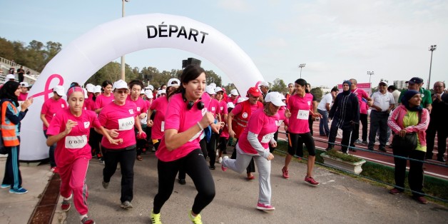 ALGIERS, ALGERIA - OCTOBER 21: Participants, wearing pink shirts form a human ''pink ribbon'', take part in a Breast Cancer Marathon within the Breast Cancer Awareness Month events in Algiers, Algeria on October 21, 2016. (Photo by Bechir Ramzy/Anadolu Agency/Getty Images)