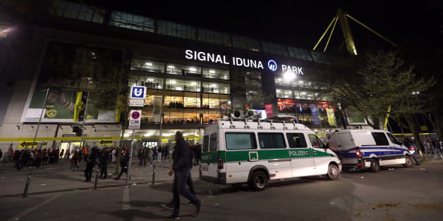 Police outside the ground after the game was postponed following an incident on the team coach