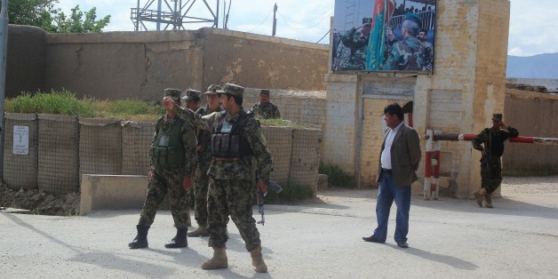 BALKH, AFGHANISTAN - APRIL 22: Afghan security officials are seen after ambulances carry people, who got wounded on Taliban fighters' attack to the 209th Corps, to hospitals in Balkh province, Afghanistan on April 22, 2017. (Photo by Sayed Khodaberdi Sadat/Anadolu Agency/Getty Images)