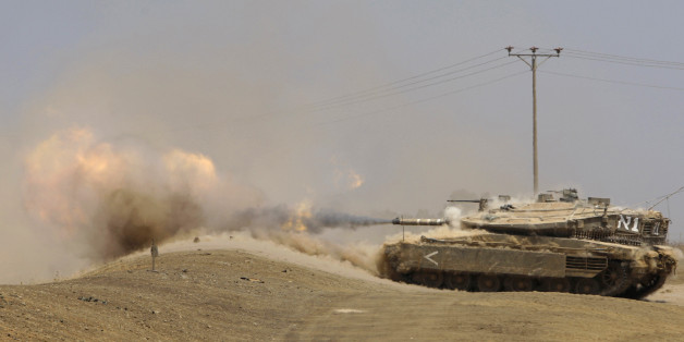An Israeli tank fires a shell during training near the northern city of Katzrin in the Golan Heights July 30, 2008. Israel and Syria will hold their next indirect peace talks in Turkey in mid-August after failing to move on to face-to-face negotiations, a source close to the talks said on Wednesday. Negotiations centre on the fate of the Golan Heights, a strategic plateau which Israel captured from Syria in the 1967 Middle East war. Damascus demands the return of all of Golan. REUTERS/Baz Ratne