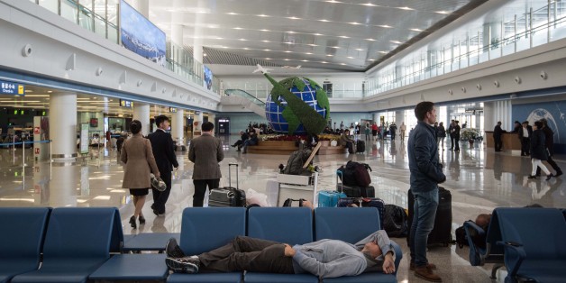 Travellers wait at Pyongyang airport on April 17, 2017.Tourists and foreign journalists, who attended the huge military parade on April 15 during which North Korea showcased apparent intercontinental ballistic missiles, were left waiting at Pyongyang airport as flights were delayed. / AFP PHOTO / ED JONES (Photo credit should read ED JONES/AFP/Getty Images)