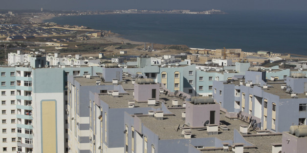A general view shows newly constructed residential buildings in Ain Benian on the outskirts of the Algerian capital Algiers, July 8, 2013. Political and social pressures are combining to open Algeria's construction market to international competition, potentially making billion of dollars worth of contracts available to foreign companies. Housing supply has long been a source of public discontent in Algeria, which has a young and growing population of 37 million. Migration to the cities has packed some extended families into tiny apartments or forced them to live in shacks. Picture taken July 8, 2013. REUTERS/Ramzi Boudina (ALGERIA - Tags: REAL ESTATE BUSINESS)