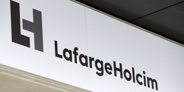 A picture taken on March 9, 2017, in Paris, shows a board on the facade of the French headquarters of LafargeHolcim, a group created in 2015 by the merger of French cement manufacturer Lafarge and its Swiss counterpart Holcim.French-Swiss group LafargeHolcim is ready to sell its cement to build US President Donald Trump's controversial border wall, the company's CEO said in an interview. The wall Trump promised to erect along the US-Mexico border, valued at tens of billions of dollars, is at the