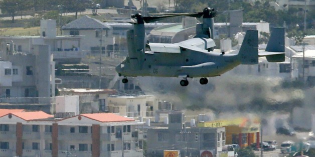 An MV-22 Osprey aircraft of the U.S. Marine Corps flies to land at the Marines' Futenma Air Station in Ginowan, Okinawa Prefecture, in this photo taken by Kyodo October 1, 2012. Six Ospreys departed from the Marines' Iwakuni air base in Yamaguchi Prefecture to be deployed to the Futenma base amid strong public opposition, Kyodo news reported. MANDATORY CREDIT. REUTERS/Kyodo (JAPAN - Tags: POLITICS MILITARY) FOR EDITORIAL USE ONLY. NOT FOR SALE FOR MARKETING OR ADVERTISING CAMPAIGNS. THIS IMAGE