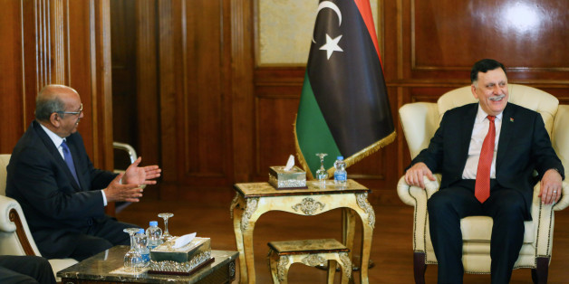 Algeria's Minister Delegate for Maghreb and African Affairs, Abdelkader Messahel (L), meets with with Libyan Prime Minister Fayez al-Sarraj in the capital Tripoli on April 21, 2017. / AFP PHOTO / MAHMUD TURKIA (Photo credit should read MAHMUD TURKIA/AFP/Getty Images)