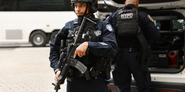 NEW YORK, NY - APRIL 24: Police officers stand near the scene where two people were shot near Battery Park in Lower Manhattan on April 24, 2017 in New York City. The two victims, believed to be innocent bystanders and not in critical condition, are a 35-year-old woman wounded in the leg and a 40-year-old man struck in the side. Reports indicate the shooting was a result of an argument between two males and no arrests have yet been made. (Photo by Spencer Platt/Getty Images)