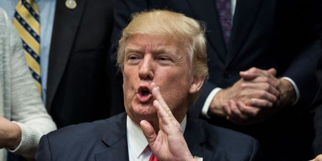 US President Donald Trump answers a question after signing an executive order about education in the Roosevelt Room of the White House April 26, 2017 in Washington, DC. / AFP PHOTO / Brendan Smialowski (Photo credit should read BRENDAN SMIALOWSKI/AFP/Getty Images)
