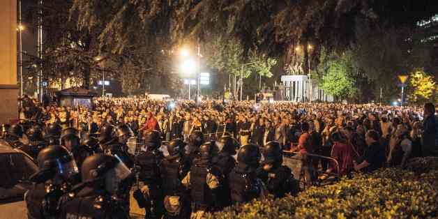 Police face protesters gathered outside Macedonia's parliament after the governing Social Democrats and ethnic Albanian parties voted to elect an Albanian as parliament speaker in Skopje on April 27, 2017.
Macedonia's opposition leader was among at least 10 people injured in parliament on April 27 after protesters stormed the building following an allegedly unfair vote for a parliamentary speaker, witnesses and local media reported. The violence erupted after around 100 protesters supporting the rival VMRO-DPMNE party entered parliament waving Macedonian flags and singing the national anthem. / AFP PHOTO / Robert ATANASOVSKI (Photo credit should read ROBERT ATANASOVSKI/AFP/Getty Images)