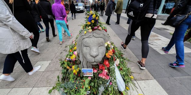 People walk by flowers near Ahlens department store at the pedestrian street Drottninggatan in central Stockholm on April 12, 2017, five days after a hijacked beer truck plowed into pedestrians there killing four people, injuring 15 others.
/ AFP PHOTO / TT News Agency / Fredrik SANDBERG / Sweden OUT (Photo credit should read FREDRIK SANDBERG/AFP/Getty Images)