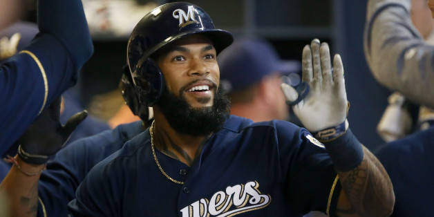 MILWAUKEE, WI - APRIL 25: Eric Thames #7 of the Milwaukee Brewers celebrates with teammates after hitting a home run in the sixth inning against the Cincinnati Reds at Miller Park on April 25, 2017 in Milwaukee, Wisconsin. (Photo by Dylan Buell/Getty Images)