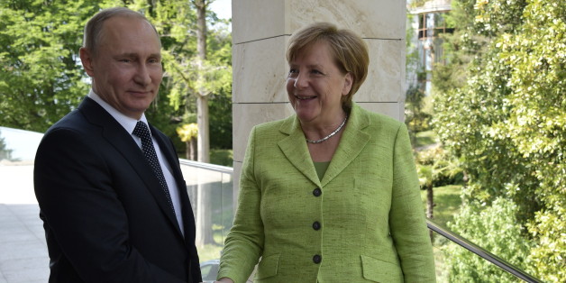 SOCHI, RUSSIA - MAY 2, 2017: Russia's President Vladimir Putin (L) welcomes Germany's Chancellor Angela Merkel at Bocharov Ruchei residence. Alexei Nikolsky/Russian Presidential Press and Information Office/TASS (Photo by Alexei Nikolsky\TASS via Getty Images)