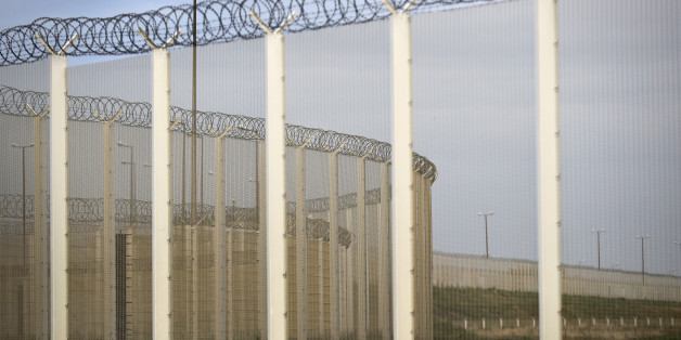 CALAIS, FRANCE - SEPTEMBER 04: Security fencing to prevent migrants surrounds the Port of Calais on September 4, 2016 in Calais, France. Local people and business owners are taking part in a protest, dubbed Operation Escargot blocking the A16 motorway and are calling for The Jungle camp at the French port to be demolished. Up to 10,000 migrants are now living at the camp and are using desperate and violent measures to try and board trucks heading for the UK. (Photo by Christopher Furlong/Gett