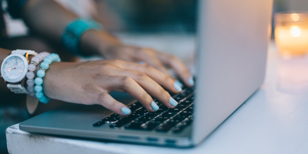 Hands of teenage girl on the computer keyboard