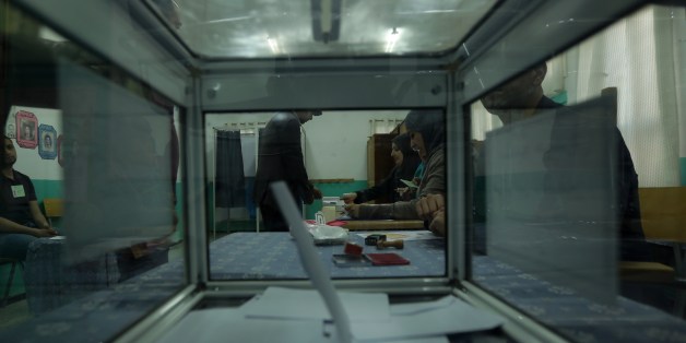 A polling station is seen through a ballot box as a vote in the presidential elections is casted on April 17, 2014 in Algiers. Algeria's incumbent Presisdent Abdelaziz Bouteflika is widely expected to win despite his chronic health problems, warnings of fraud and opposition calls for a boycott. AFP PHOTO/PATRICK BAZ (Photo credit should read PATRICK BAZ/AFP/Getty Images)