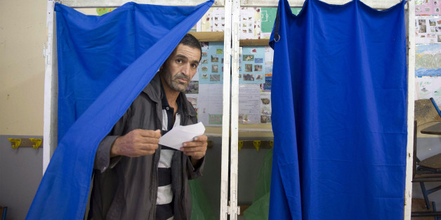 An Algerian man casts his vote at a polling station in the town of Blida, 45 kilometres (30 miles) southwest of Algiers, on May 4, 2017 during parliamentary elections.Algerians voted for a new parliament amid soaring unemployment and a deep financial crisis caused by a collapse in oil revenues. / AFP PHOTO / stringer (Photo credit should read STRINGER/AFP/Getty Images)