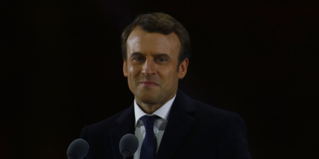 Emmanuel Macron and his wife Brigitte Macron salute voters after his speech as he celebrates his Presidential election victory At Le Louvre In Paris on May 7, 2017 in Paris, France. Emmanuel Macron won the French Presidential election over extreme right candidate Marine Le Pen. (Photo by Mehdi Taamallah) (Photo by Mehdi Taamallah/NurPhoto via Getty Images)