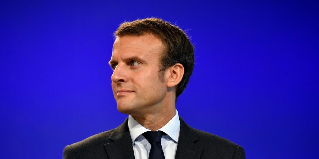France's former Minister of the Economy Emmanuel Macron looks on after handling over power to French Minister of Finance and also current Minister of Economy Michel Sapin in Paris, on August 31, 2016 following his resignation as economy minister.France's Emmanuel Macron vowed after stepping down as economy minister on August 30, 2016 to 'transform' an ailing country but stopped short of declaring a presidential run. The 38-year-old said he had 'seen at first hand the limits of our political syst