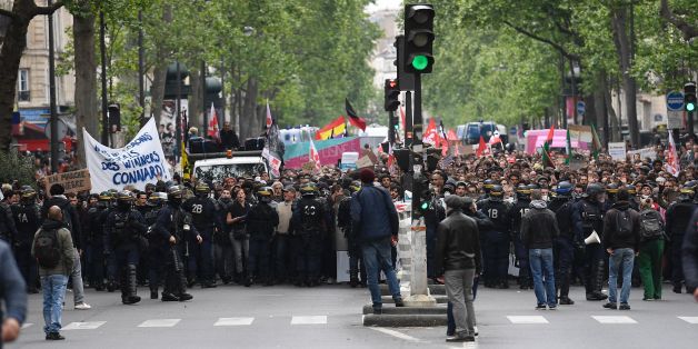 Riot police officers block a street while people take part in a demonstration called by the collectif 'Front Social' and labour unions on May 8, 2017 a day after the French presidential election. / AFP PHOTO / Lionel BONAVENTURE (Photo credit should read LIONEL BONAVENTURE/AFP/Getty Images)