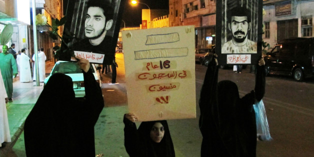 Protesters hold posters of prisoners during a protest in Qatif March 9, 2011. Saudi Shi'ites staged another small protest in the kingdom's eastern province on Wednesday, defying a ban on demonstrations. More than 100 mostly young men gathered in the main Shi'ite city of Qatif on the Gulf coast to demand the release of prisoners they say are held without trial, witnesses said. Banner reads: "Forgotten, in prison 16 year". REUTERS/Stringer (SAUDI ARABIA - Tags: POLITICS CIVIL UNREST)