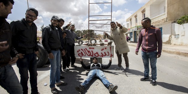 TATAOUNIE, TUNSIA - APRIL 11: People block a road with tires during a protest against unemployment, demanding foreign petroleum companies to employ local residents in the area, in Tataouine, Tunisia on April 11, 2017. (Photo by Nacer Talel/Anadolu Agency/Getty Images)